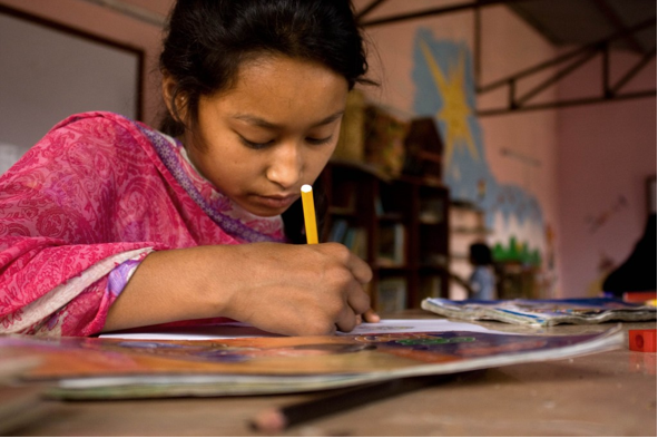 Young girl studies at the Ghar Sita Mutu Orphanage